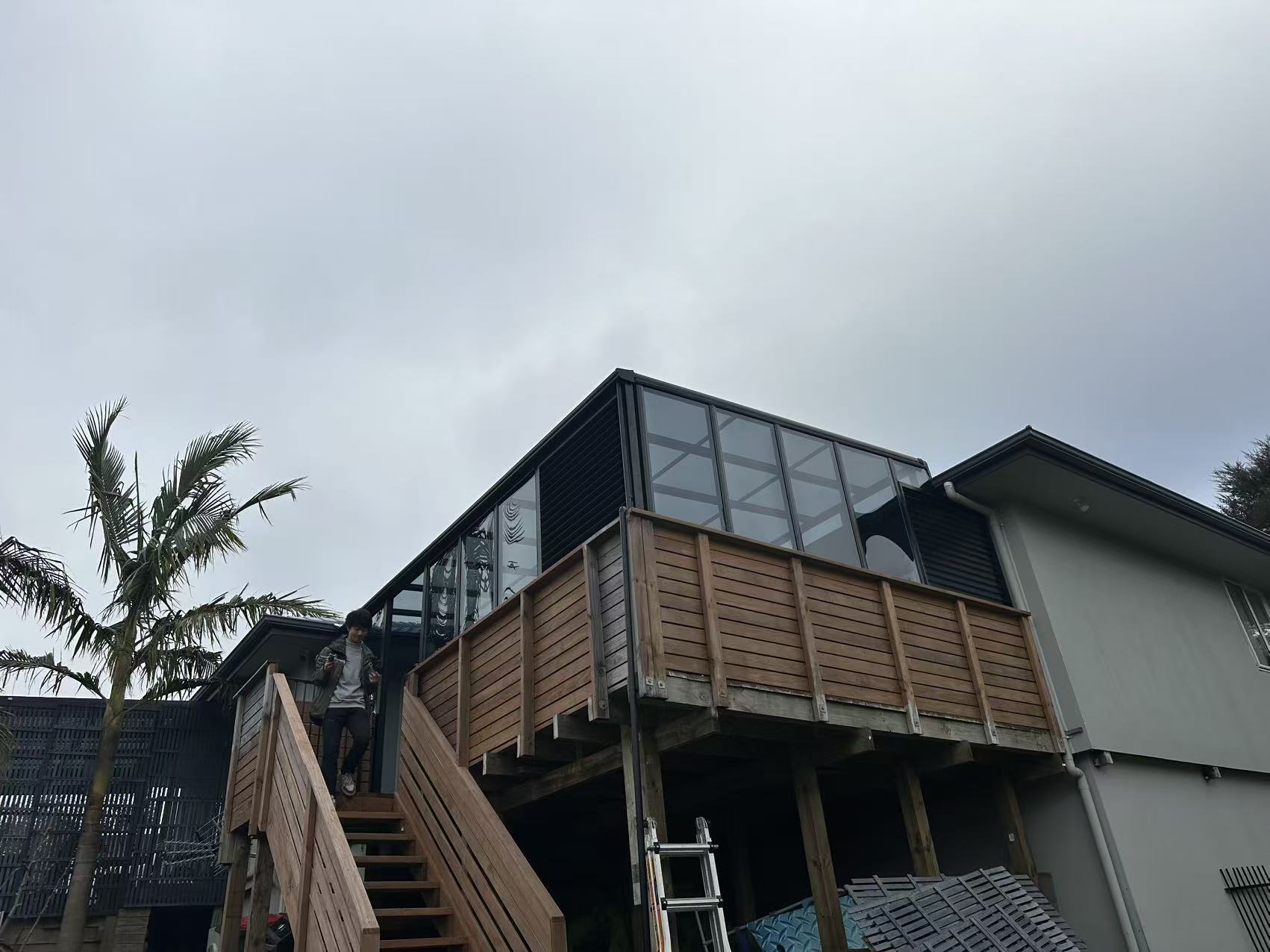 Glass room built on an elevated timber balcony